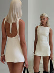 back view of model wearing Princess Polly Mayok Mini Dress Cream Crew Neck