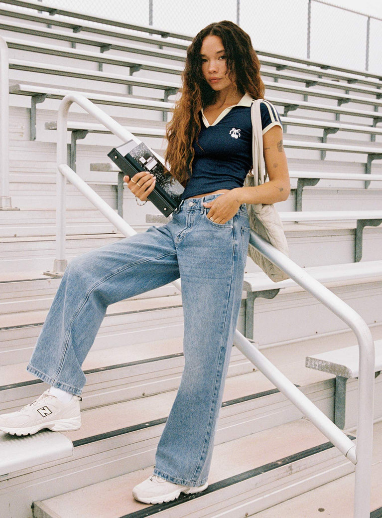 front view of model wearing Princess Polly Serenitia Mid Rise Relaxed Jeans Light Wash Mid Rise