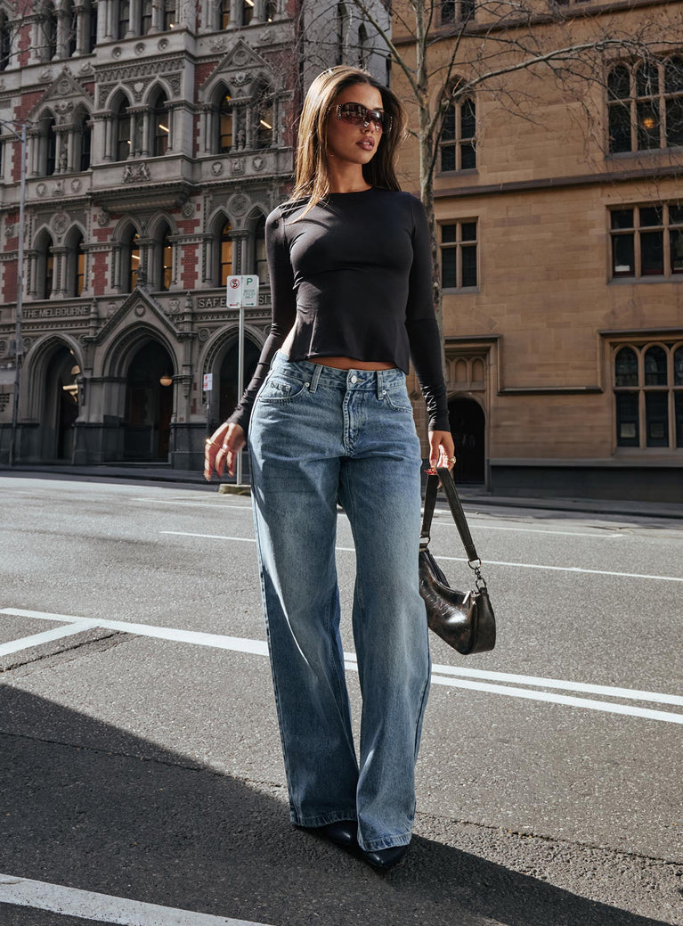 side view of model wearing Princess Polly Serenitia Mid Rise Relaxed Jeans Light Wash Mid Rise