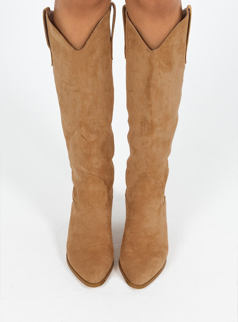 Cowboy boots Faux suede material  Detail stitching  Knee high length  Rounded hem  Pull tabs  Pointed toe  Fully lined