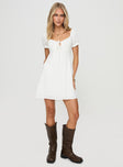 White mini dress Elasticated puff sleeves, tie fastening at bust