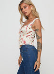 Floral crop top Fixed shoulder straps, lace trim, tie fastening at bust, split hem Non-stretch material, fully lined 