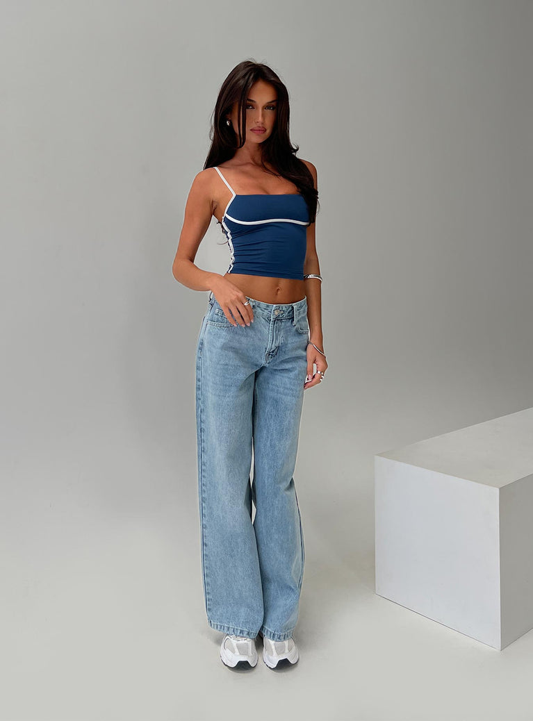 side view of model wearing Princess Polly Serenitia Mid Rise Relaxed Jeans Light Wash Mid Rise