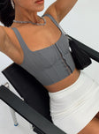 Crop top Pinstripe print  Adjustable shoulder straps  Stitched bust  Hook & eye front fastening 