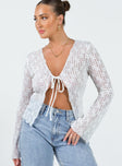Long sleeve top Sheer lace material V-neckline Single tie fastening at bust Flared sleeve