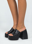Platform heels Faux leather material  Single wide upper  Block heel  Square toe  Padded footbed 