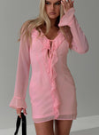 front view of model wearing Princess Polly Marisela Long Sleeve Mini Dress Pink V-Neck 