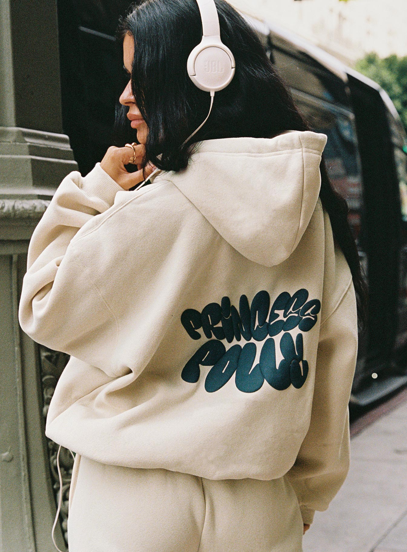 back view of model wearing Princess Polly Princess Polly Hooded Sweatshirt Bubble Text Stone / Slate Long 