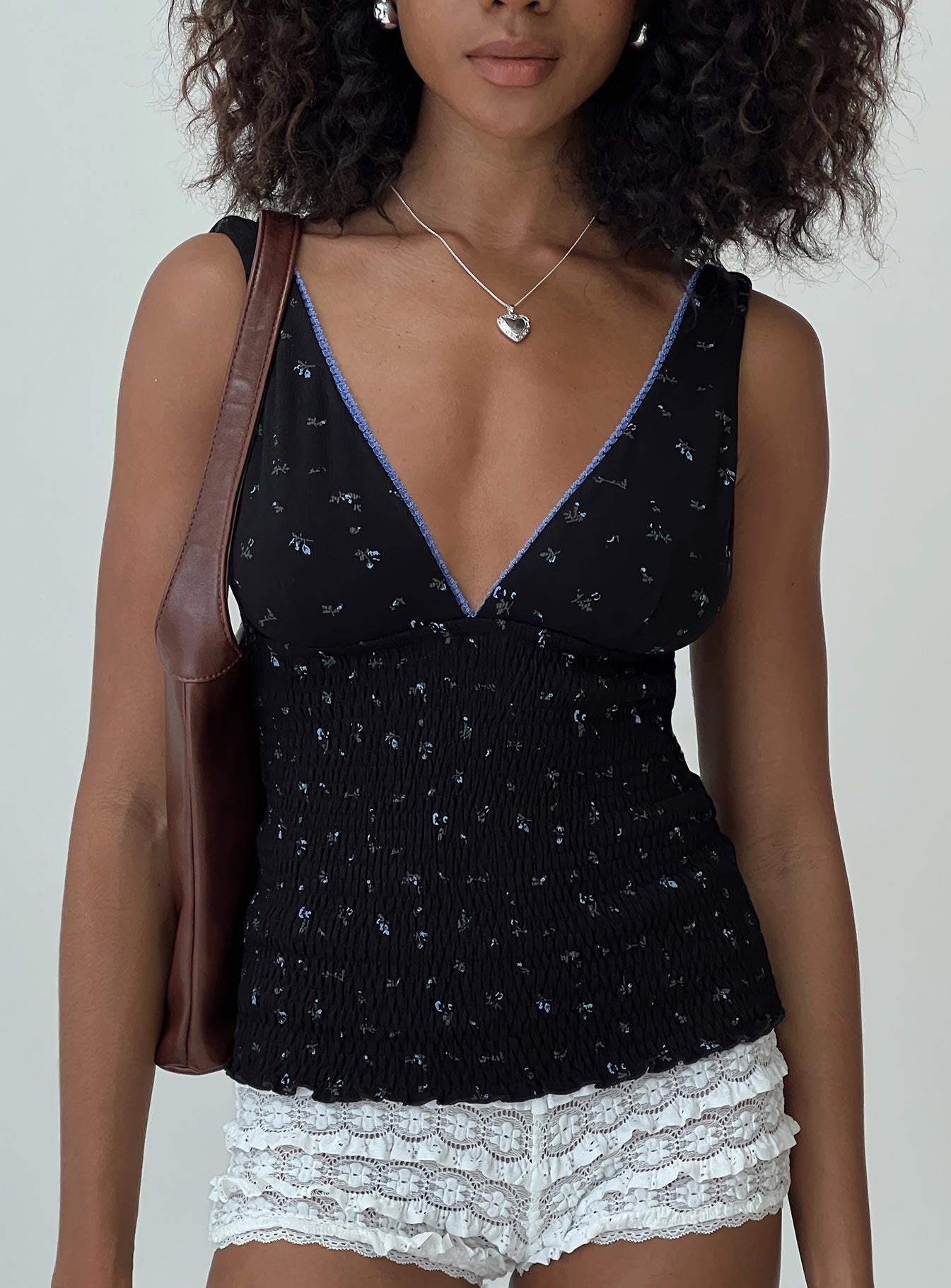 front view of model wearing Princess Polly Comfrey Top Black Sleeveless Plunger 