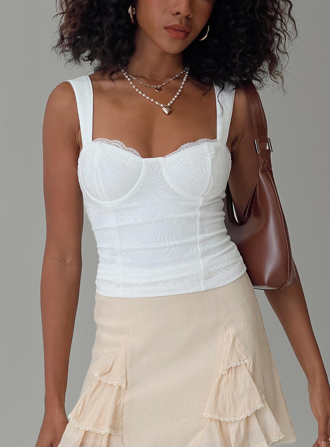 back view of model wearing Princess Polly Hazeel Top White Sleeveless Sweetheart 