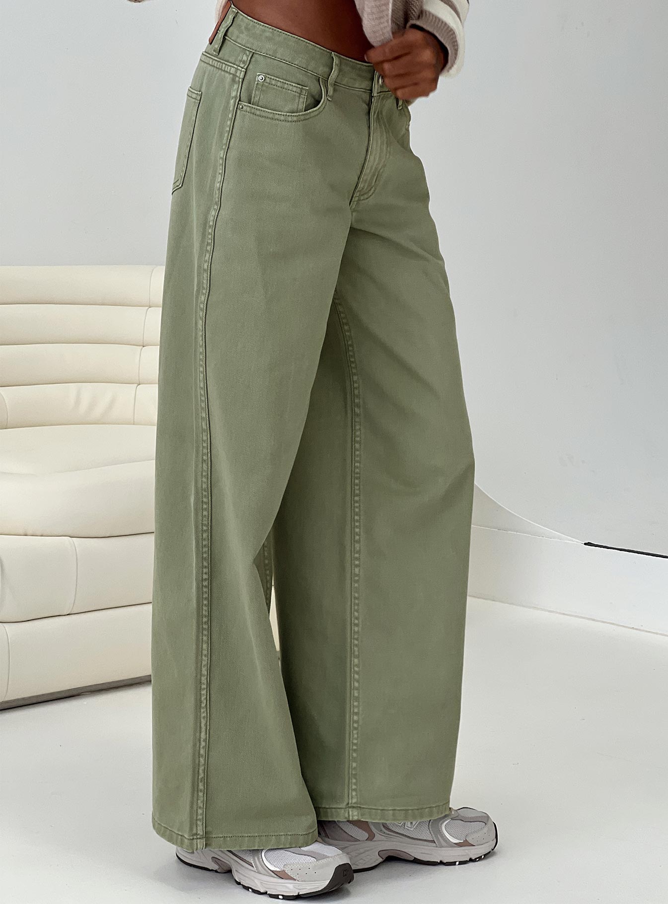 side view of model wearing Princess Polly Ramos Low Rise Denim Jeans Sage Mid Rise 