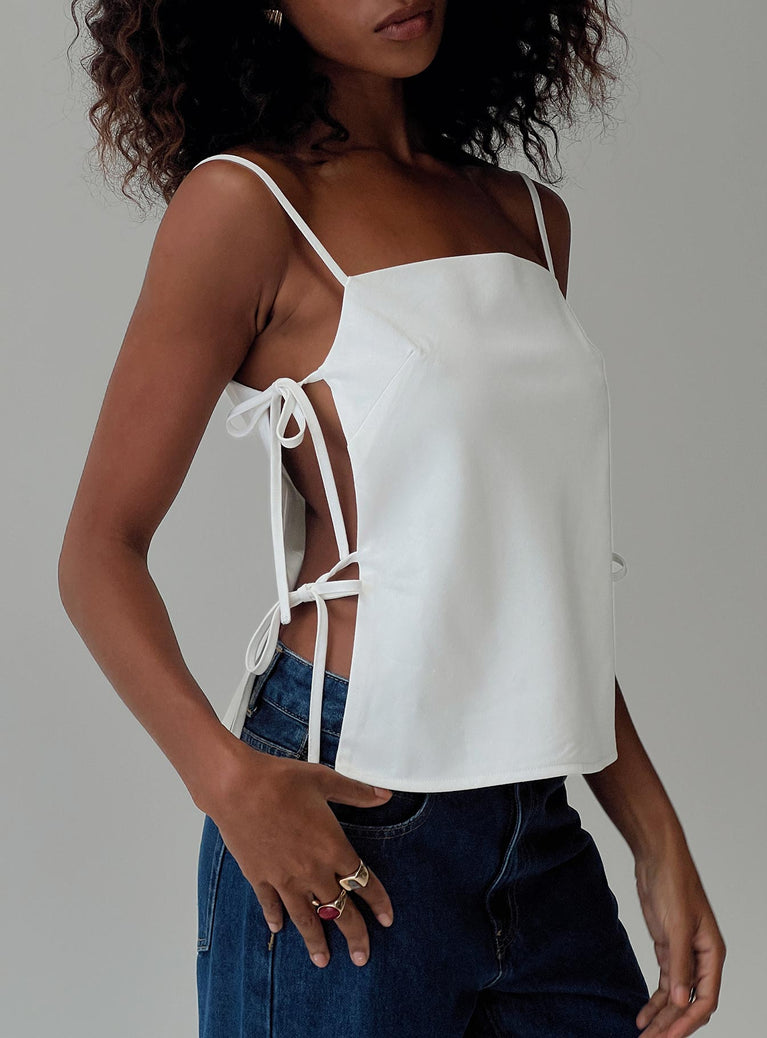 Linen top Adjustable shoulder straps, cut outs at side with tie fastening Non-stretch material, fully lined 