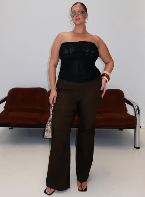 front view of model wearing Princess Polly Kinkirk Flared Pants Chocolate Curve Mid Rise Pants 
