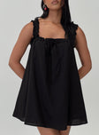 front view of model wearing Princess Polly Swing Mini Dress Black Petite Square Neck 