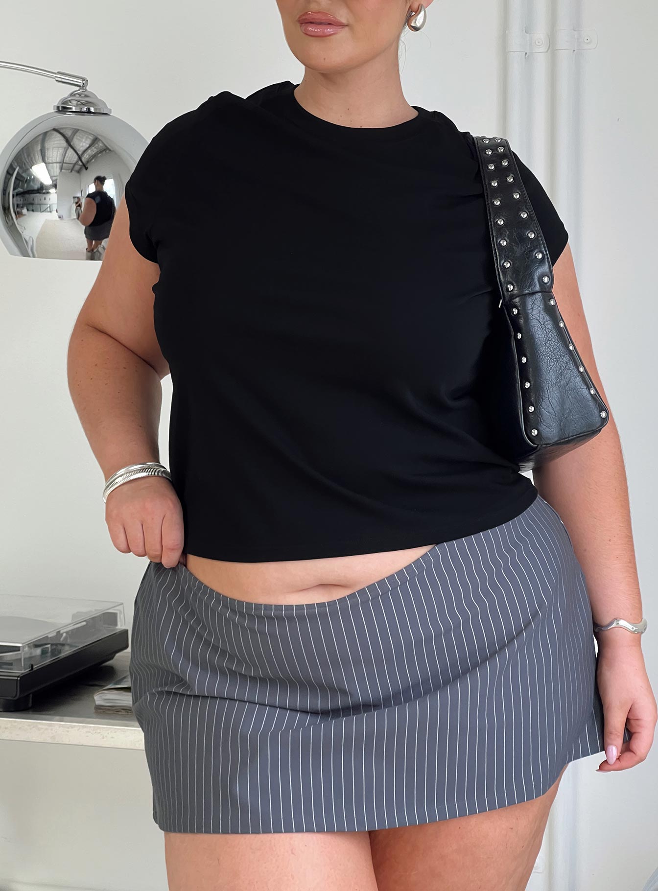 back view of model wearing Princess Polly Can't Sleep Skort Charcoal Stripe Curve High Waisted Shorts 