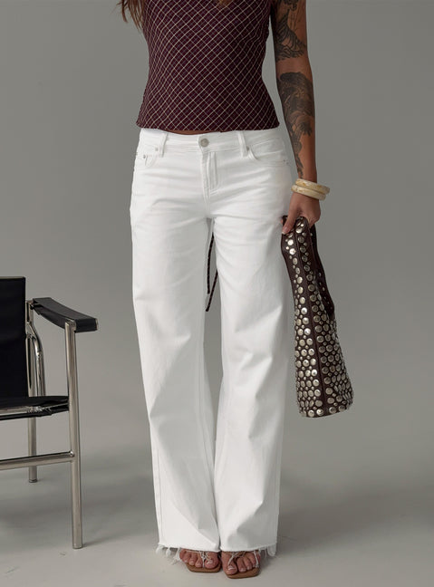 side view of model wearing Princess Polly Sabryna Low Rise Straight Leg Jeans White Low Rise Jeans 