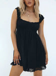 Black mini dress Anglaise material Elasticated shoulder straps Square neckline Elasticated waistband  Frill hem 