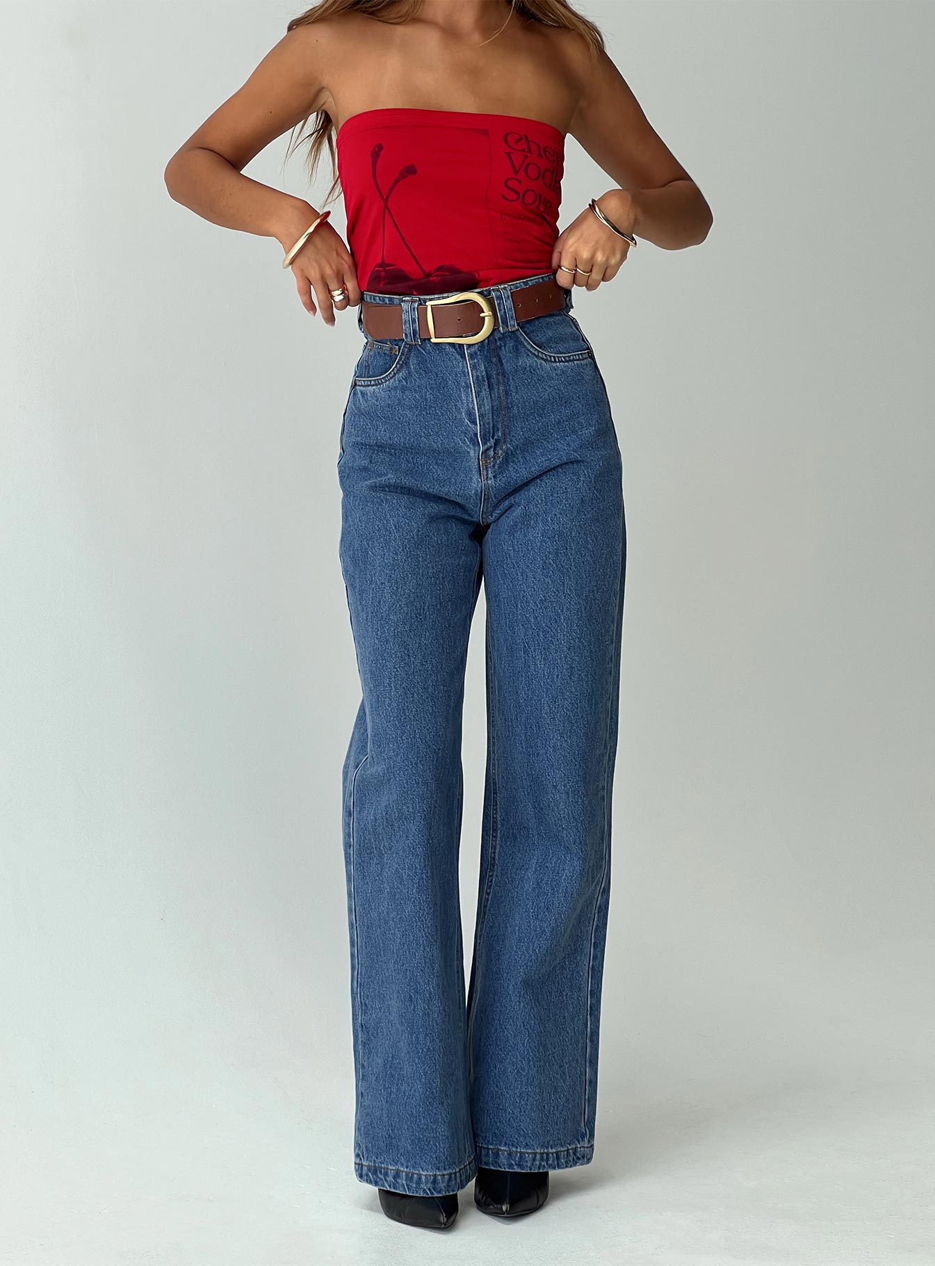 front view of model wearing Princess Polly Zephee Wide Leg Jeans Light Wash Petite High Waisted 