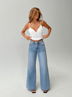 front view of model wearing Princess Polly Colemane Mid Rise Denim Jeans Angel Blue Petite Mid Rise 