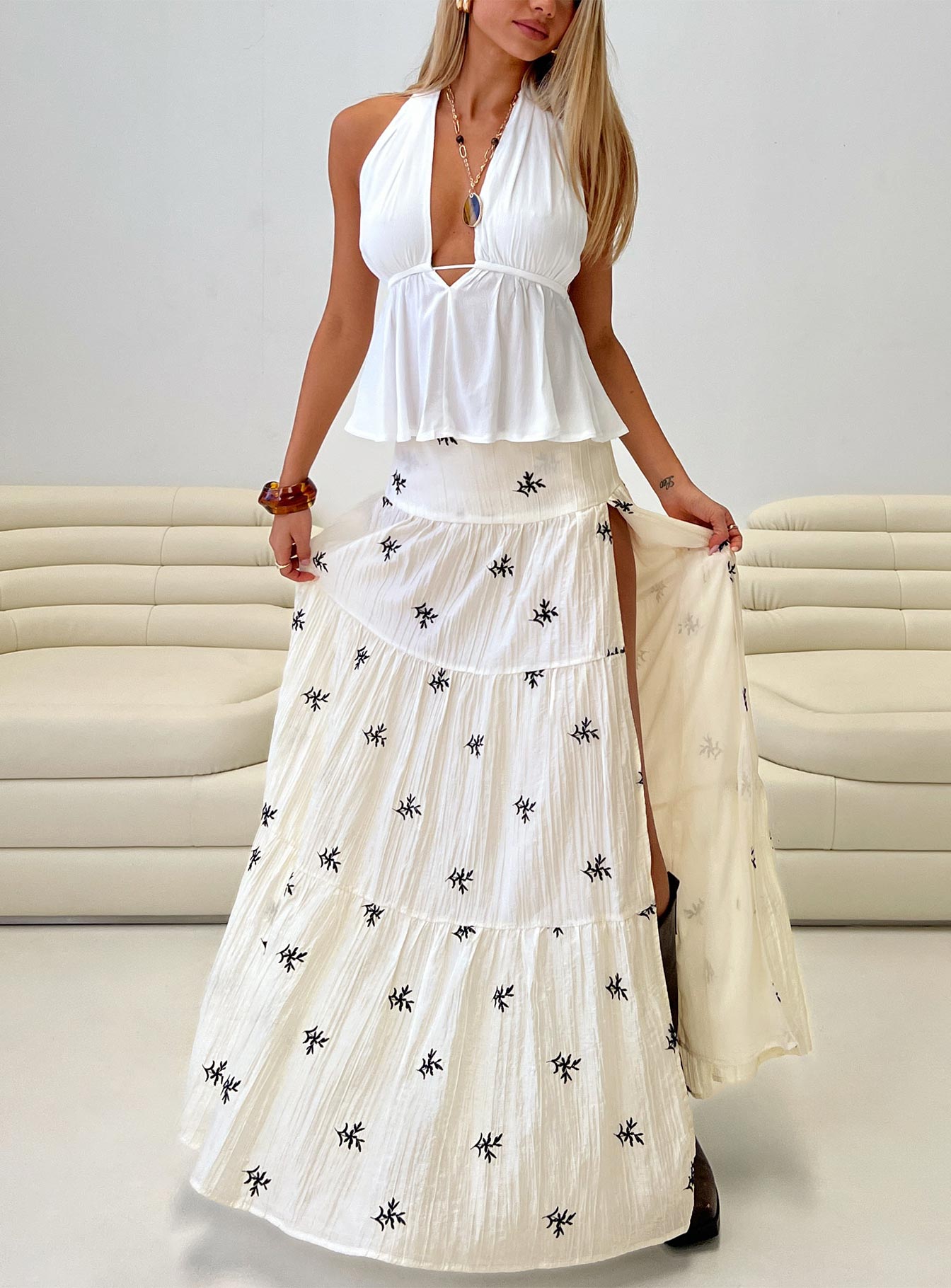  front view of model wearing Princess Polly Cinnamon Embroidered Maxi Skirt Cream / Navy Maxi 