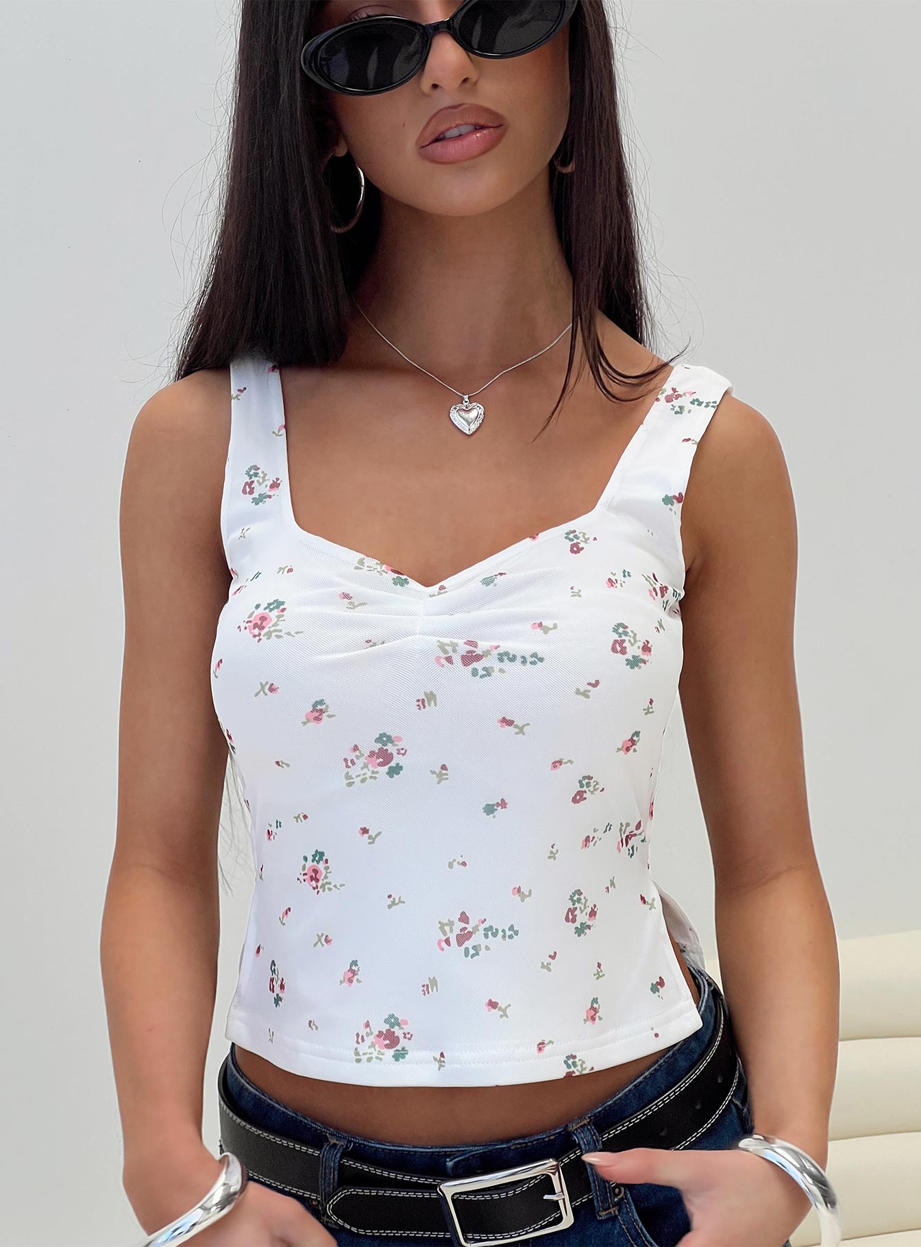 front view of model wearing Princess Polly Rehna Top White Floral Sleeveless V-Neck 
