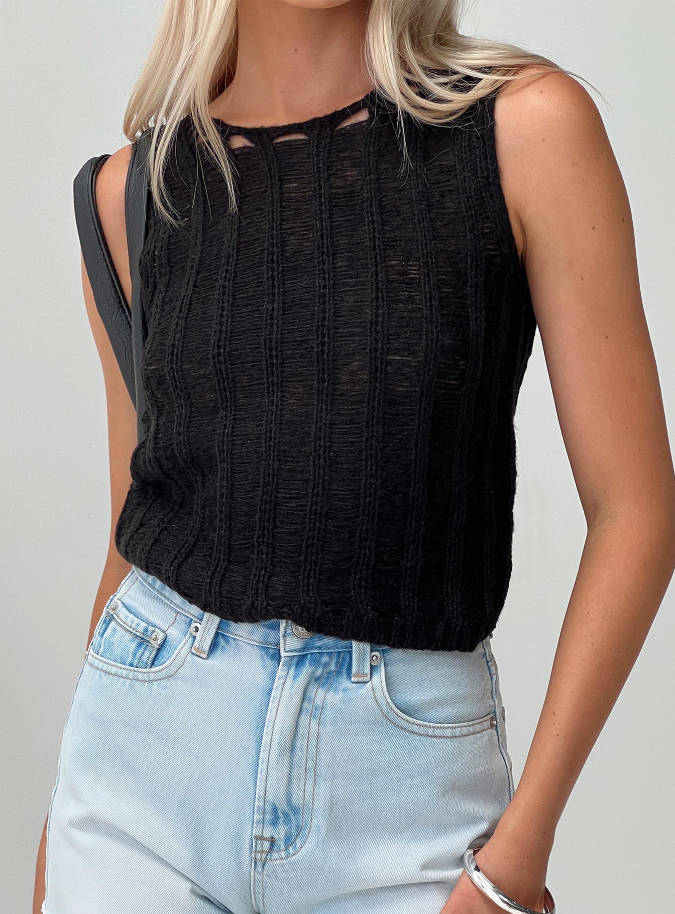 front view of model wearing Princess Polly Jella Knit Top Black Sleeveless Crew Neck 