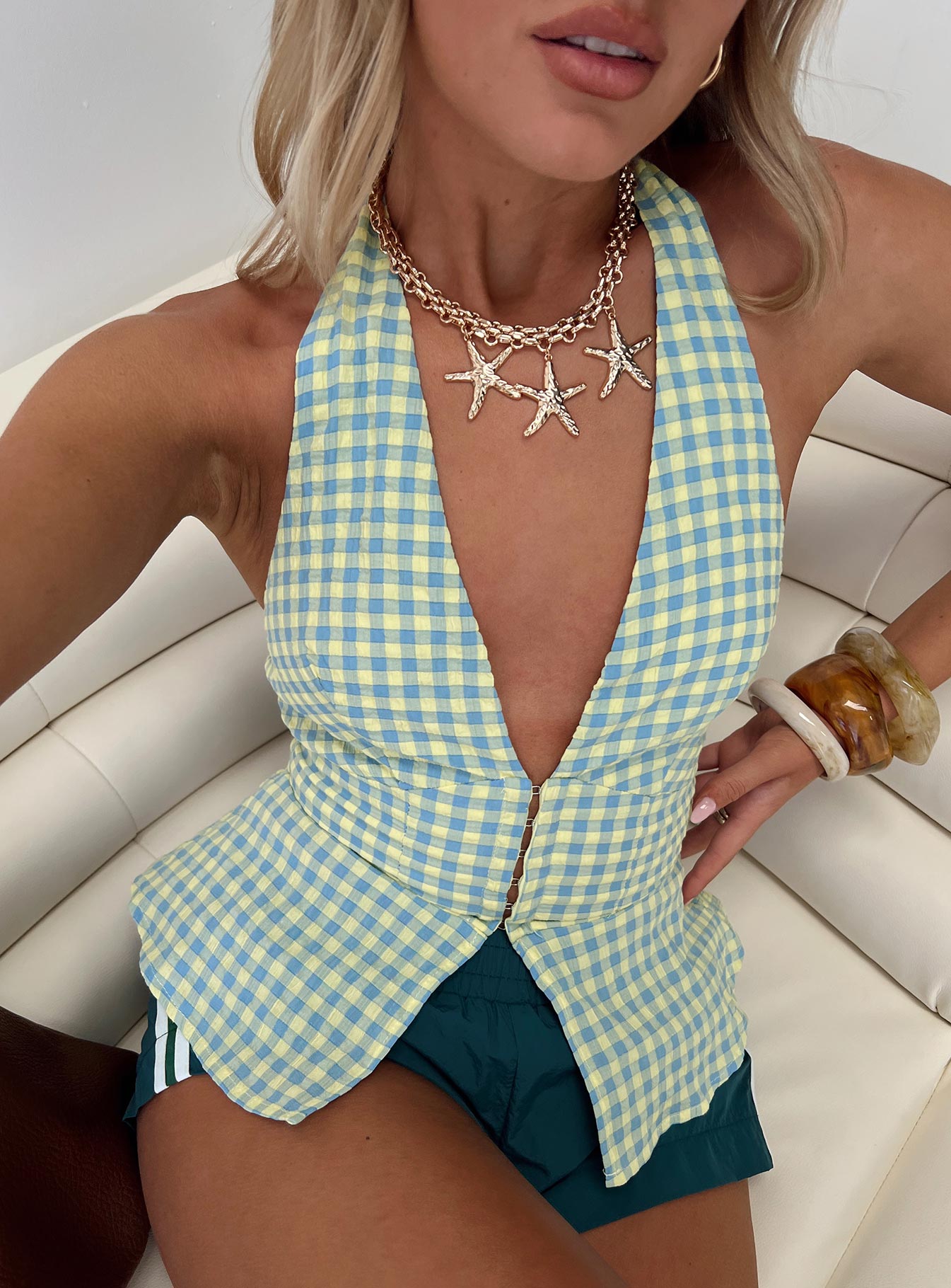 side view of model wearing Princess Polly Becci Halter Top Multi Sleeveless Plunger 