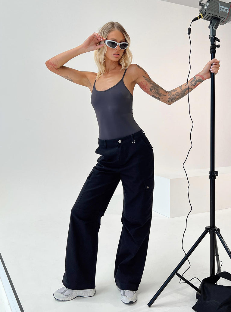 Mid-rise Cargo pants  Relaxed fit, Zip and button fastening, Belt looped waist, Classic hip pockets, Press button leg and back pockets, Wide leg 