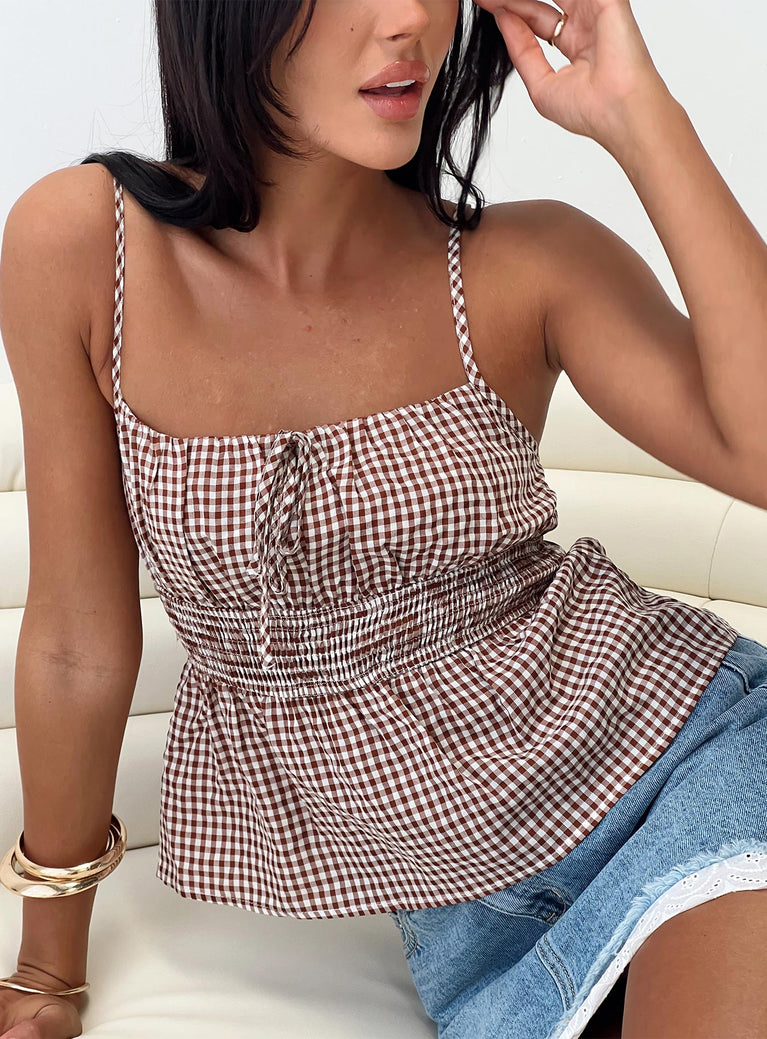 Gingham print top Adjustable shoulder straps, scooped neckline, shirred band Non-stretch material, lined bust