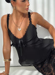 Top  Elasticated straps, lace trim, bow detail at bust, slightly sheer, invisible zip fastening Non stretch, double lined 