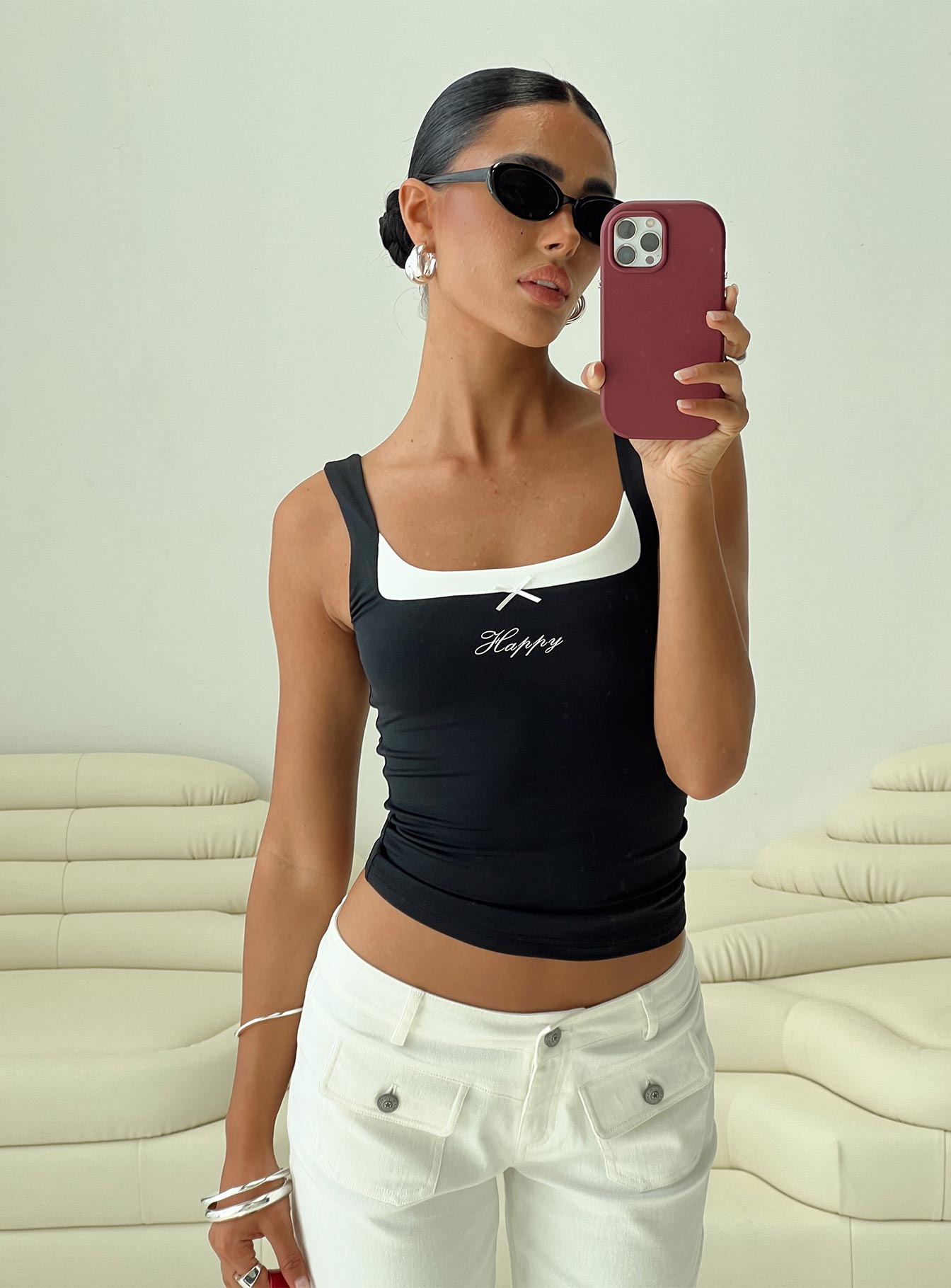 side view of model wearing Princess Polly All My Life Top Black Sleeveless Scoop Neck 