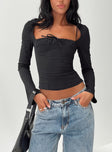 front view of model wearing Princess Polly Linsley Long Sleeve Top Black Full Sleeves Square Neck 