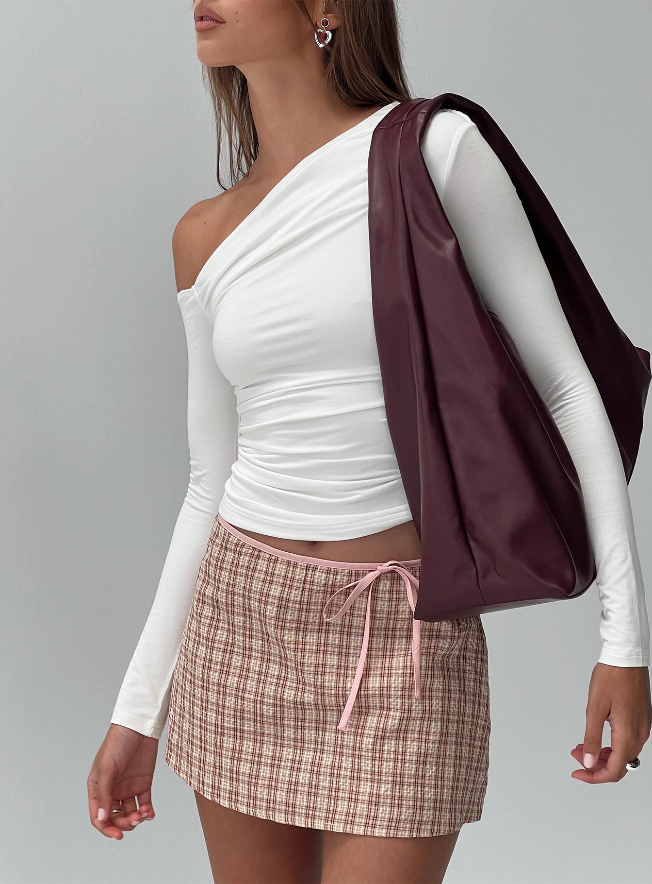 back view of model wearing Princess Polly Korren Low Rise Skort Pink Low Rise Shorts 