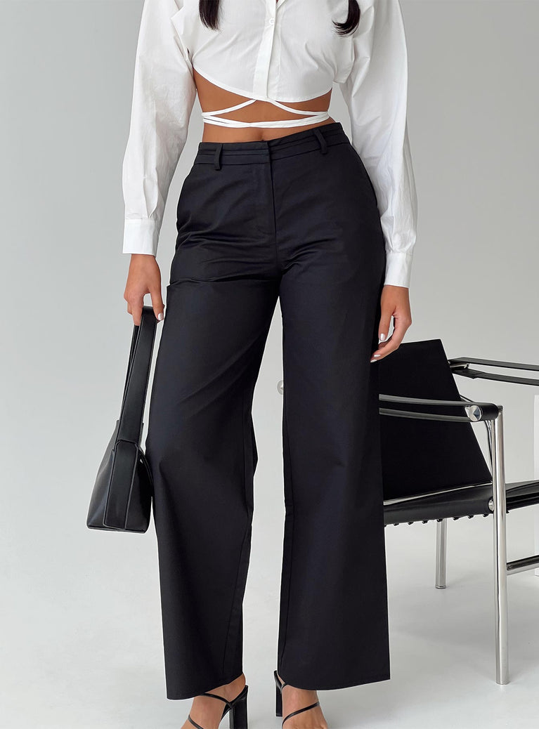 Low rise pants Zip and clasp fastening, belt looped waist, twin hip pockets, slim leg