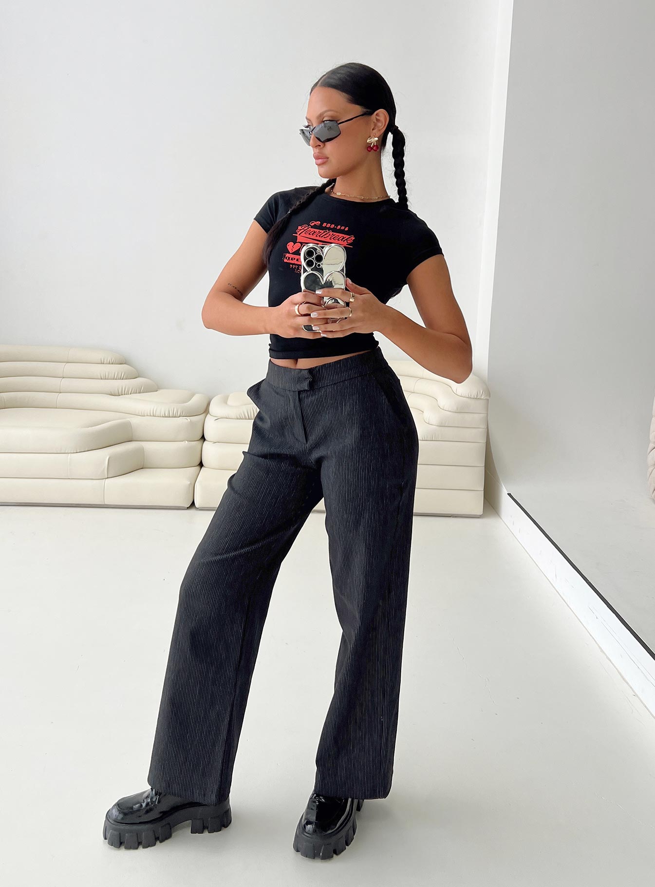 front view of model wearing Princess Polly Jeller Pinstripe Pants Black Tall High Waisted Pants 