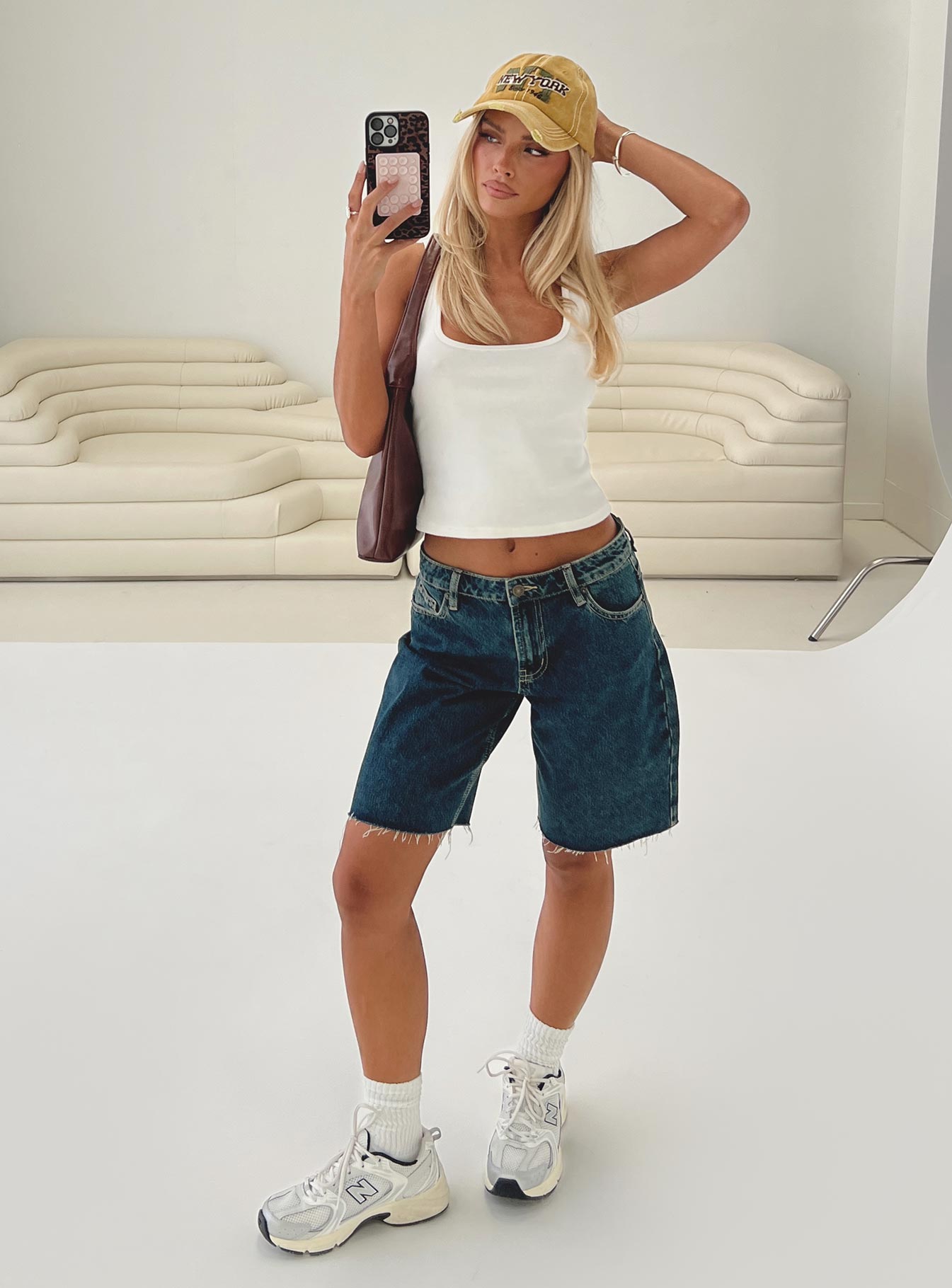 back view of model wearing Princess Polly Cult Classic Longline Denim Shorts Vintage Wash Low Rise Shorts 