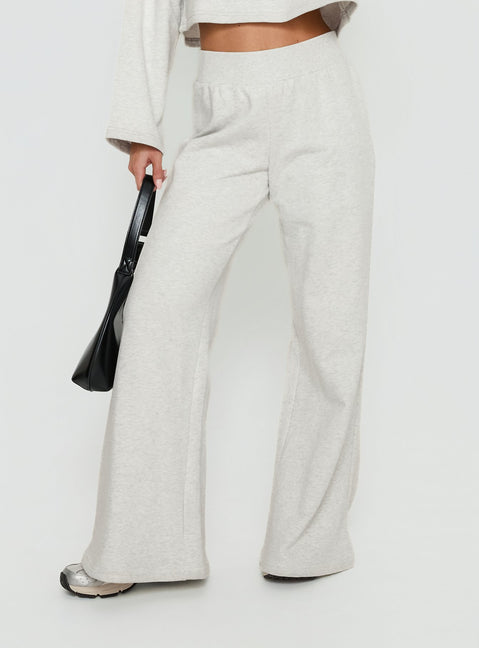 side view of model wearing Princess Polly Peaks Flared Track Pants Snow Marle Mid Rise Pants 