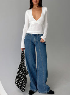 front view of model wearing Princess Polly Lando Low Rise Straight Leg Jeans Mid Blue Wash Mid Rise Jeans 