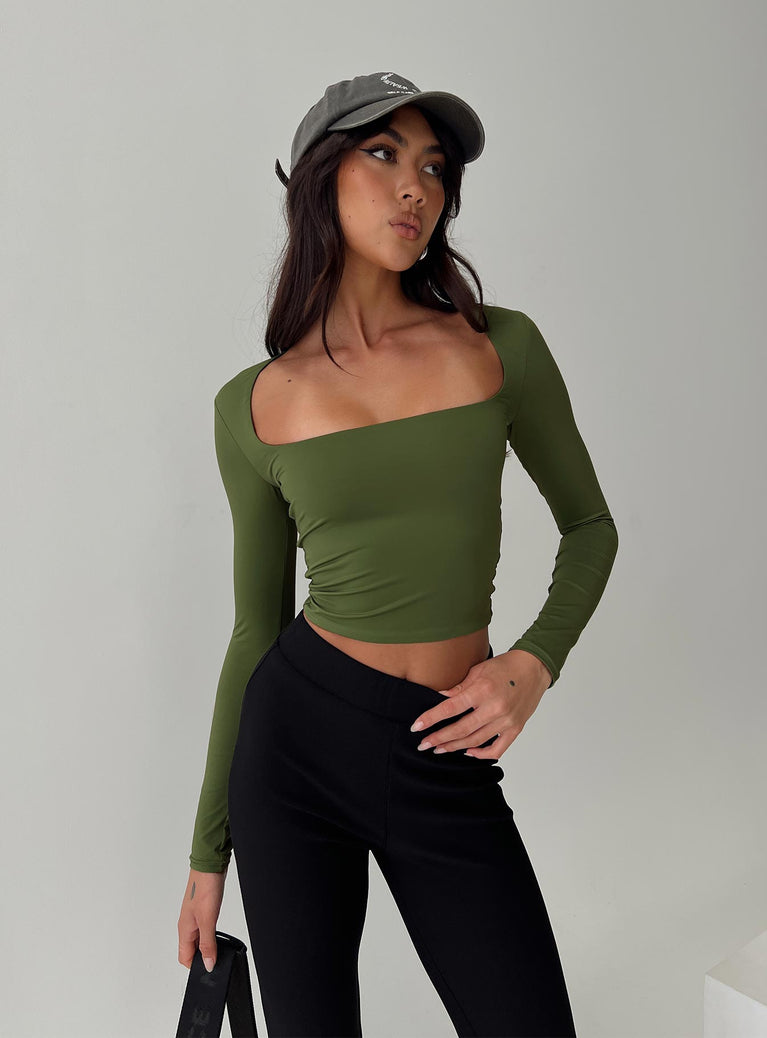 side view of model wearing Princess Polly Back In Time Long Sleeve Top Olive Full Sleeves Square Neck 