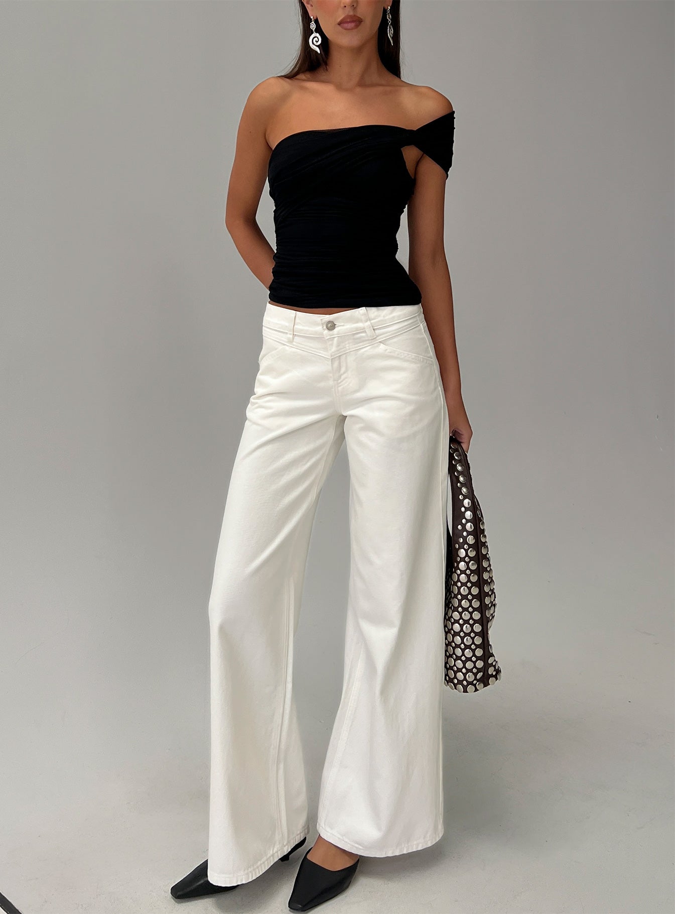 front view of model wearing Princess Polly Catiana Low Rise Wide Leg Jeans White Low Rise Jeans 