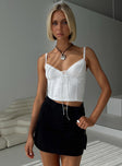 White top V neckline, adjustable straps, lace material, bow detail
