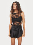 side view of model wearing Princess Polly Feelix Sleeveless Lace Bodysuit Black Sleeveless 