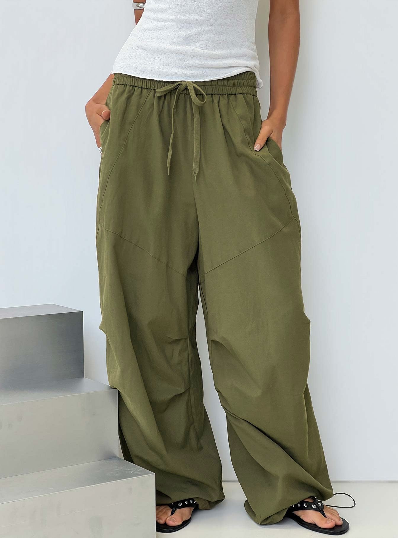 Discover the Mankind Baggy Cargo Pants Olive in womens-regular-pants with mid-rise waist front view of model wearing Princess Polly