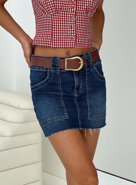Denim mini skirt High rise slim fit, four pocket design, belt looped waist, zip & button fastening, branded patch at back, raw edge hem Slight stretch, unlined 