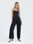 Jumpsuit Silky material Adjustable shoulder straps Lace up back Invisible zip fastening at back Wide leg