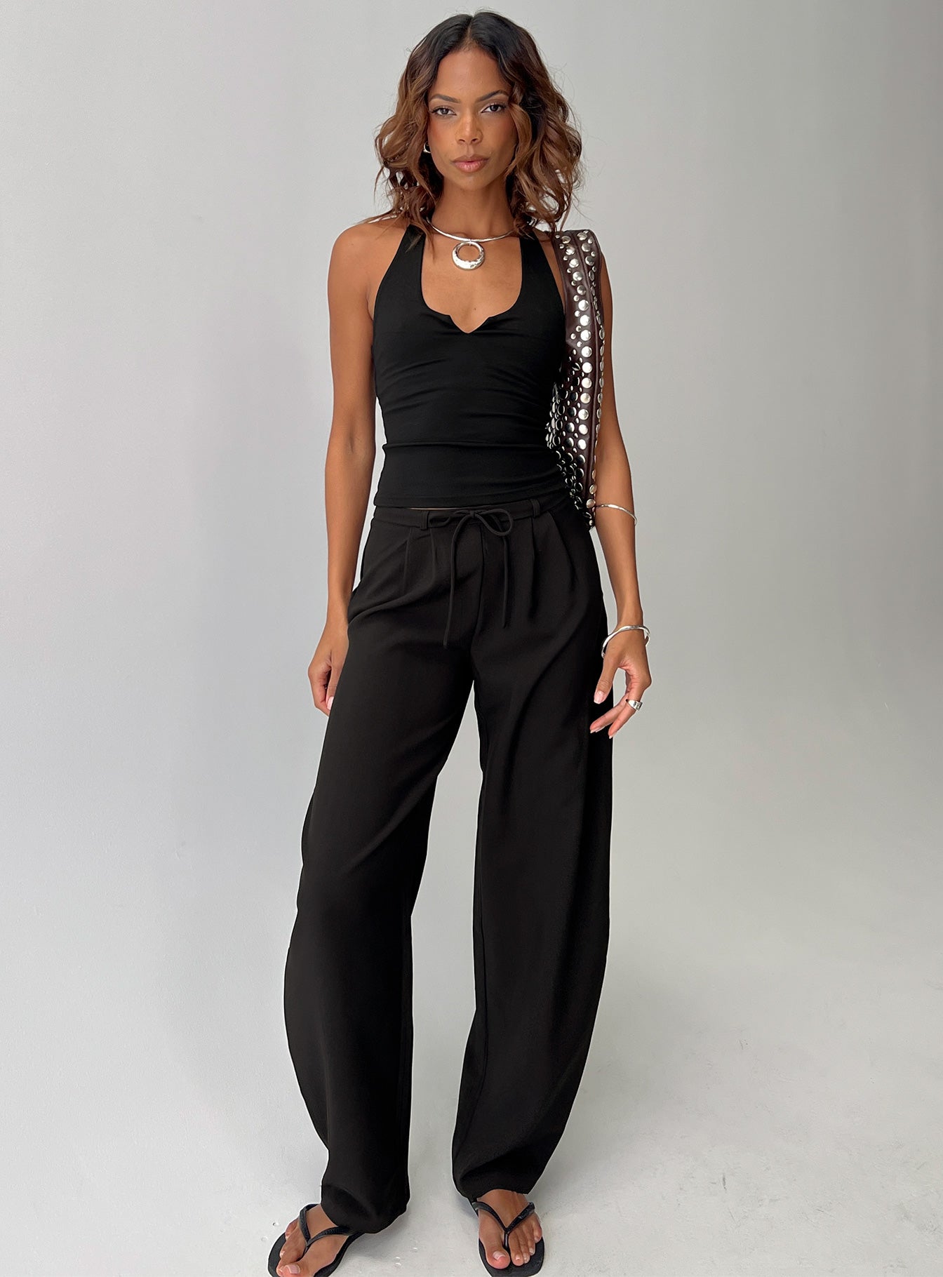 front view of model wearing Princess Polly Triffid Barrel Leg Pants Black High Rise Pants 