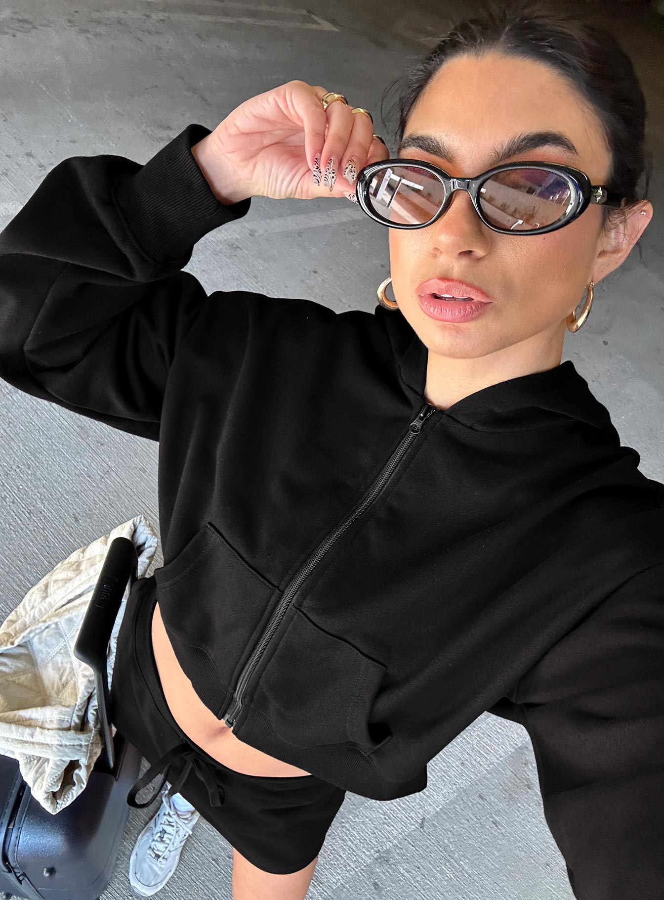 side view of model wearing Princess Polly Revive Zip Through Hoodie Black cropped 