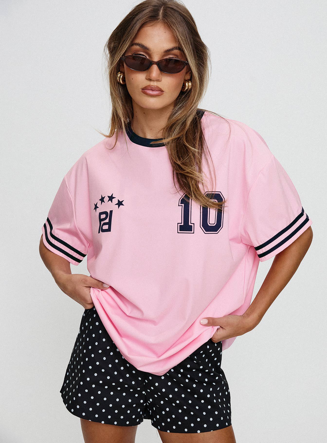 front view of model wearing Princess Polly Cornwall Football Jersey Pink Half Sleeves Crew Neck 