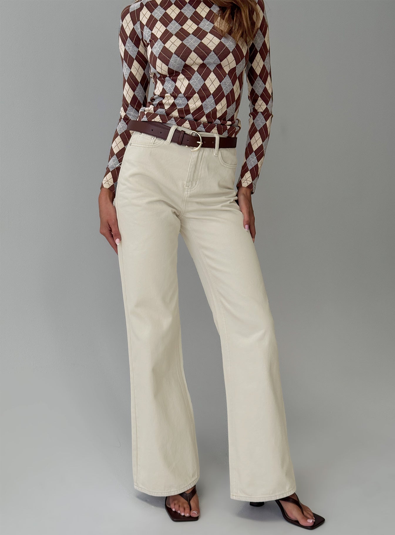 front view of model wearing Princess Polly Maple Mid Rise Flare Jeans Ecru High Rise Jeans 