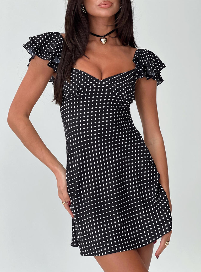 front view of model wearing Princess Polly Moretti Mini Dress Black Polka Dot Sweetheart Neckline 